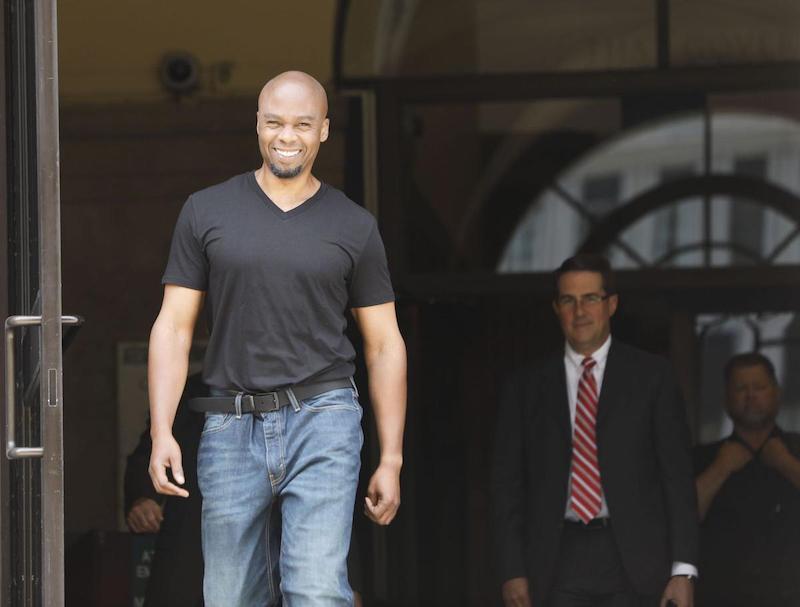 Valentino walks out of courthouse.
